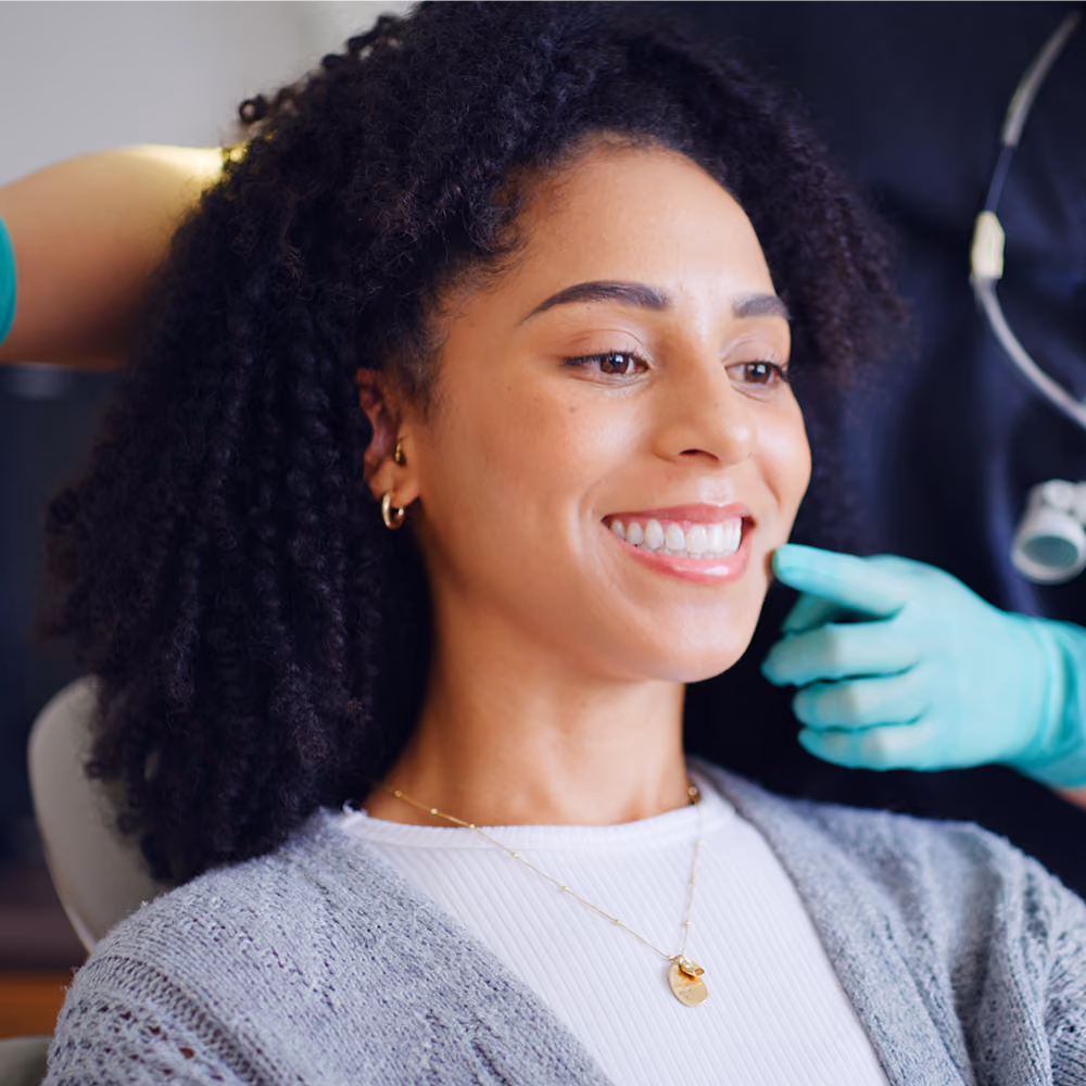 Crown, bridge, and implant restorations used to rebuild damaged teeth in Houston