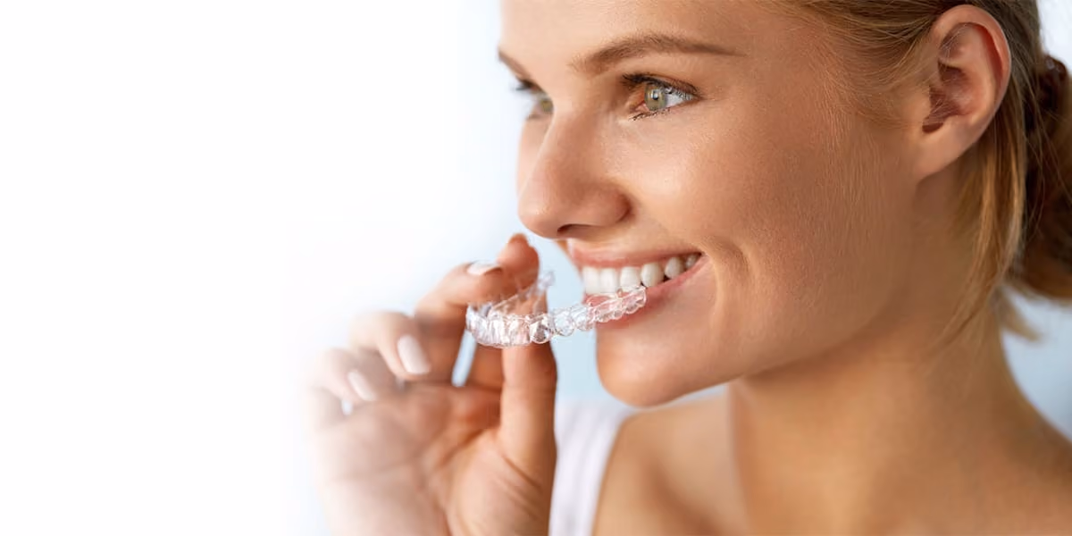 Patient wearing CandidPro clear aligners at Dentiq Dentistry in Houston, TX