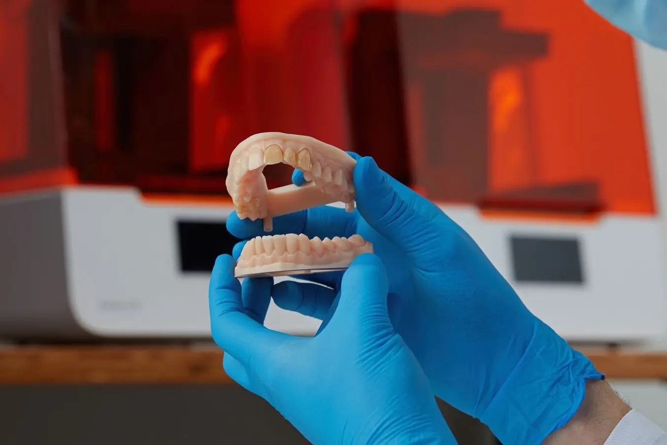 3D printer building a dental model from a digital scan at Dentiq Dentistry Houston