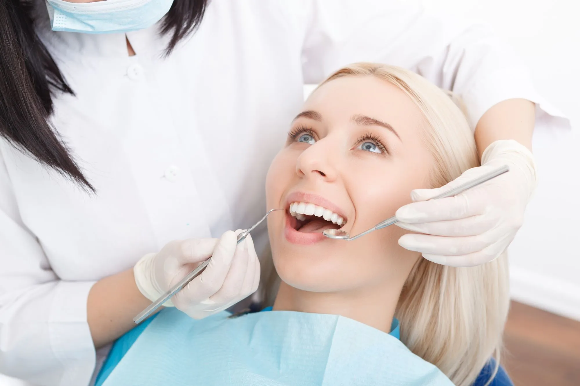 Patient receiving a comprehensive dental exam at Dentiq Dentistry in Houston, TX