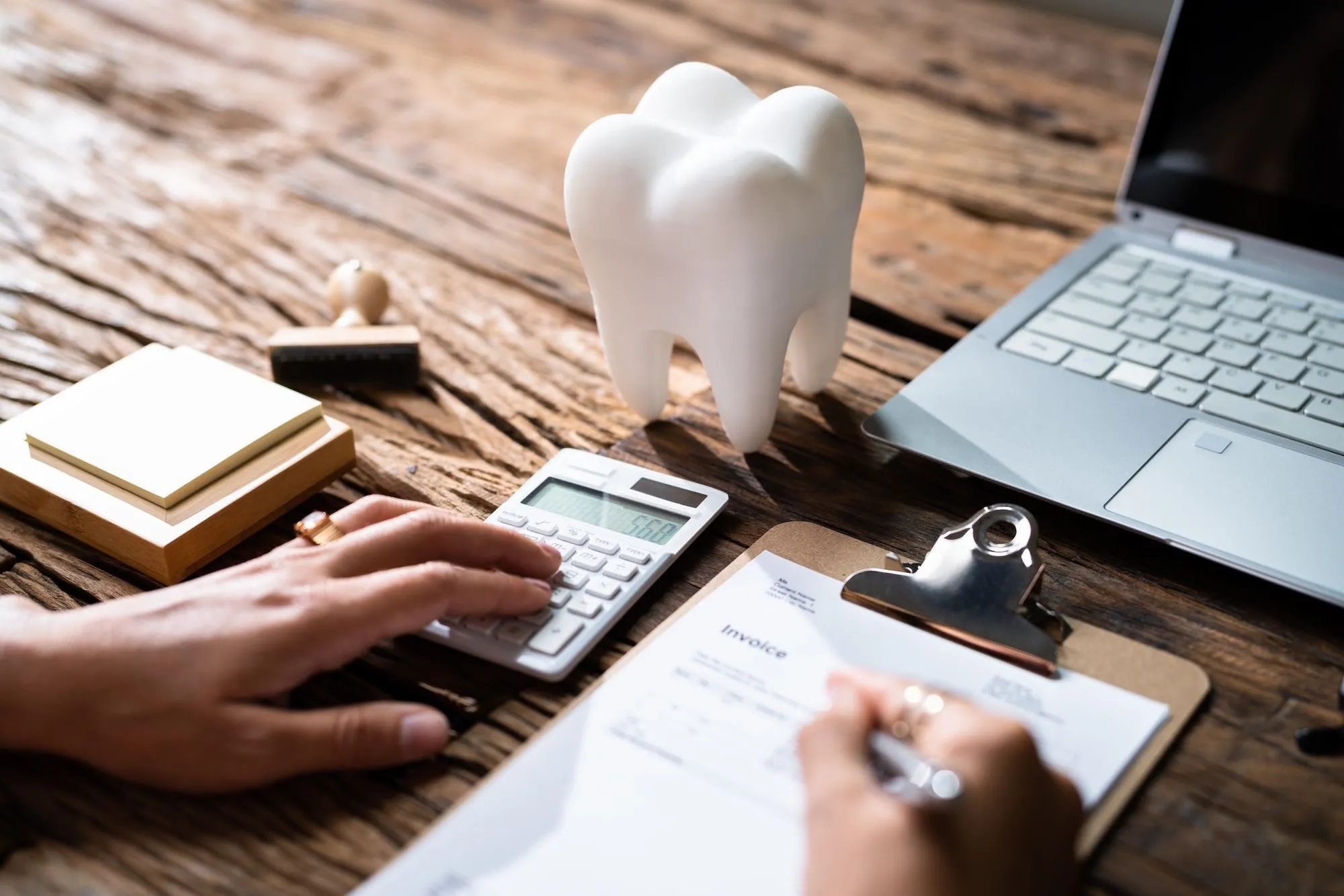 Patient exploring dental financing options at Dentiq Dentistry in Houston, TX
