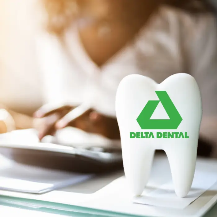Dentiq Dentistry insurance coordinator helping a patient understand Delta Dental benefits in Houston, TX
