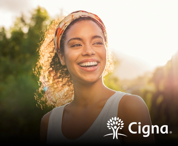 Dentiq Dentistry insurance coordinator helping a patient understand Cigna dental benefits in Houston, TX