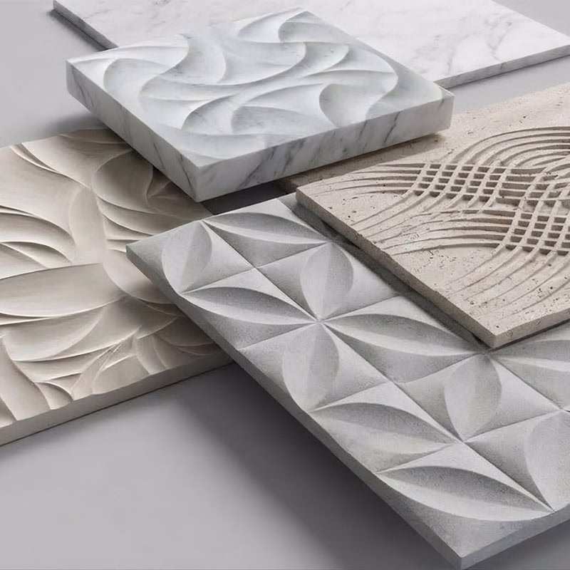 A collection of five square stone tiles with intricate 3D carved geometric patterns, including curves, intersecting lines, and petal-like shapes in various grey and beige tones.