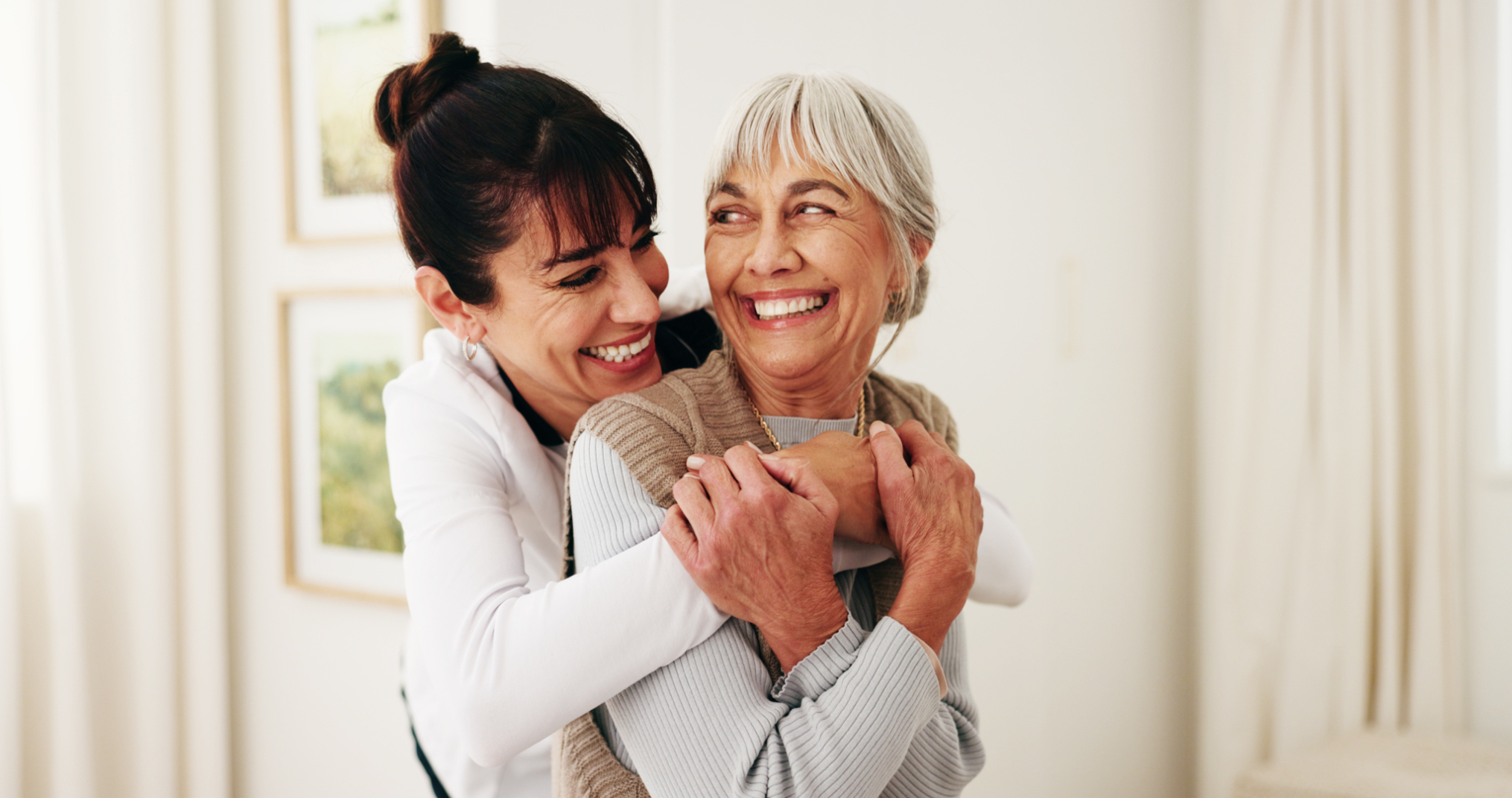 Senior women hugging stock image