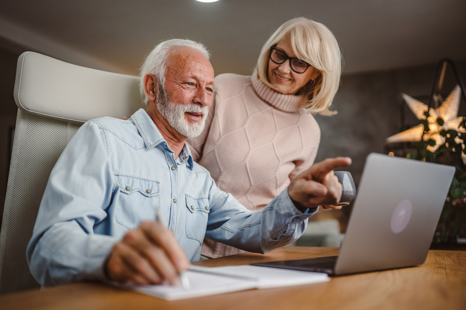 Seniors looking at computer stock image