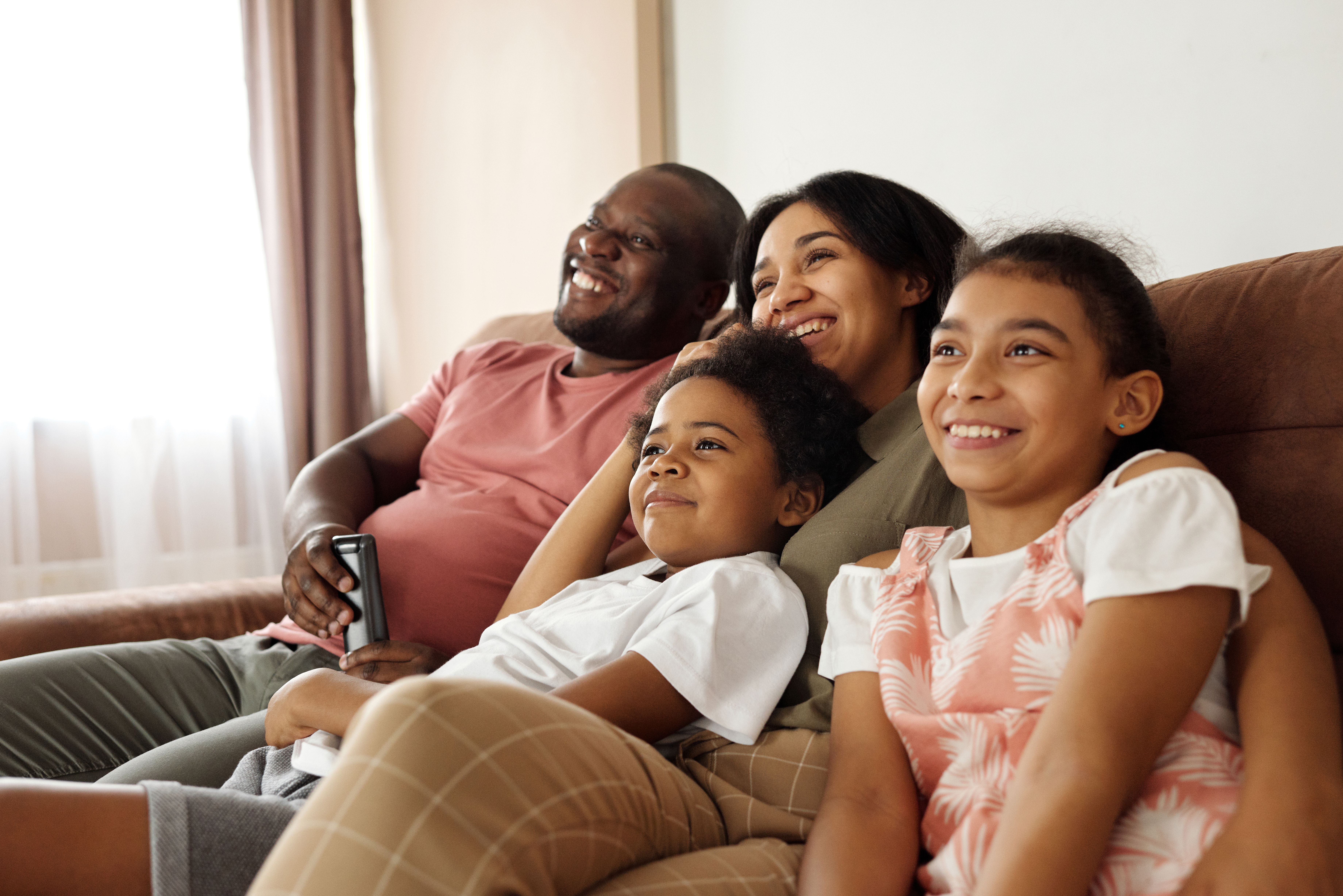 Family on couch stock image