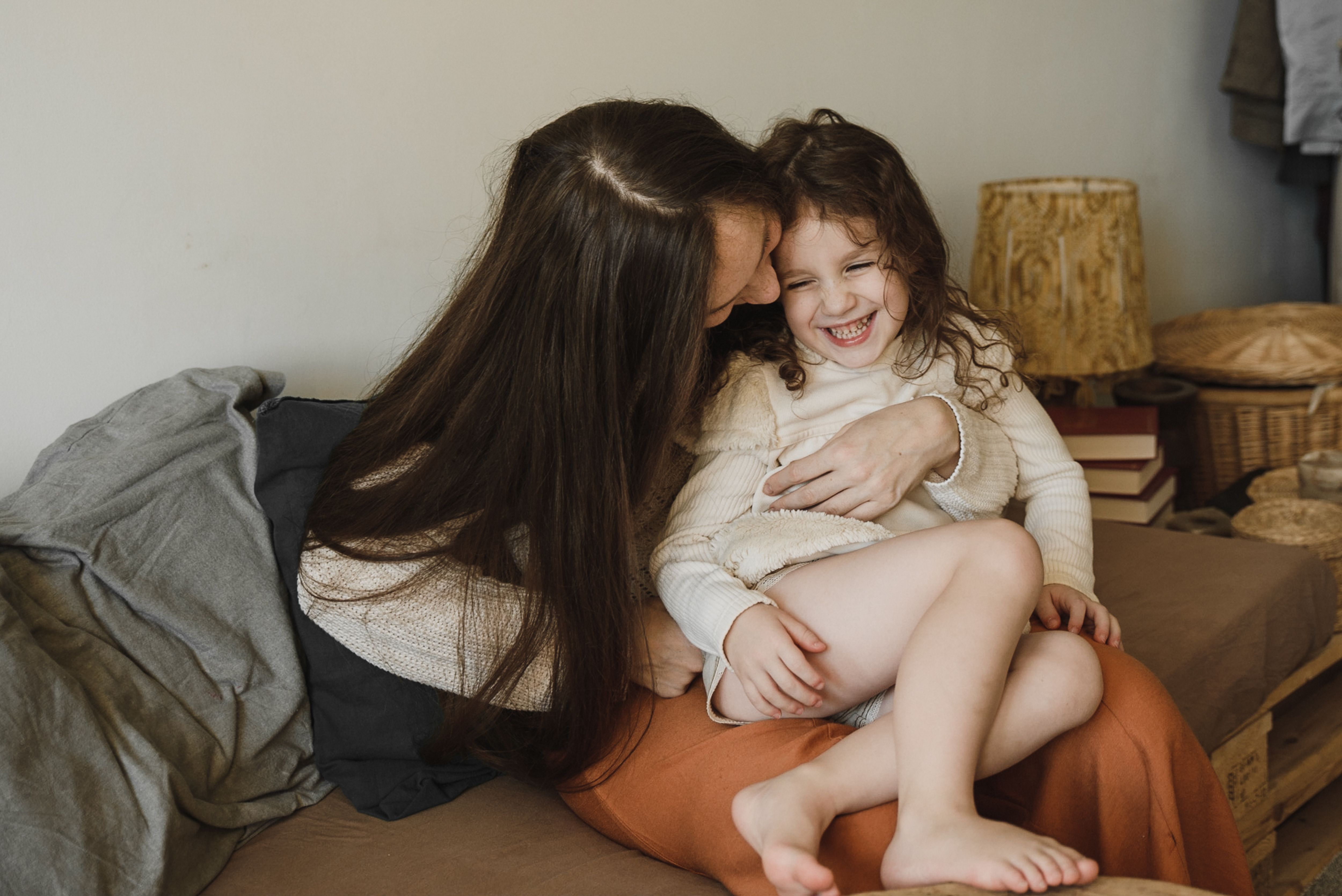 Woman and child on couch stock image