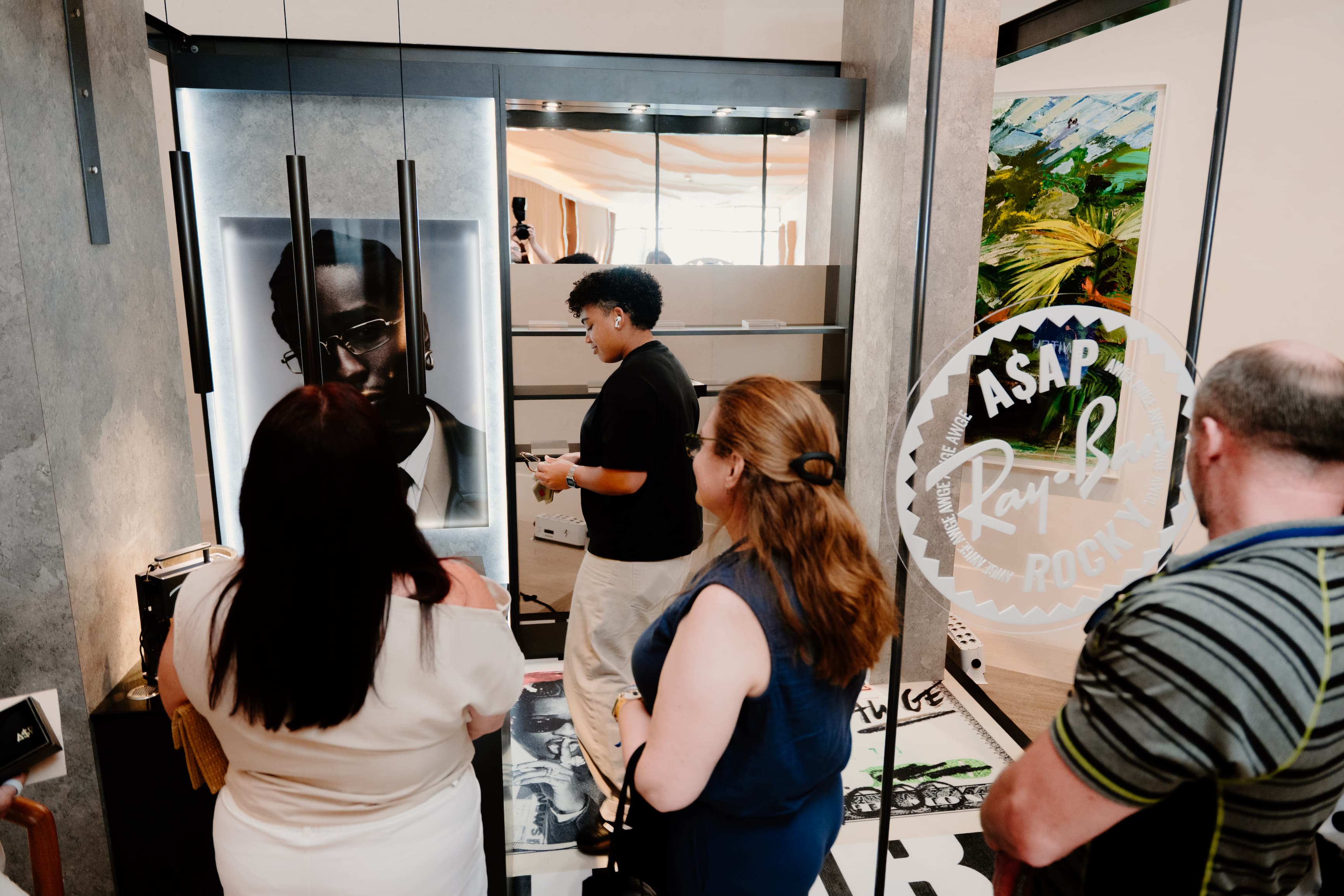 shoppers engaging with a luxottica pop-up store and booth at SWITCH Orlando