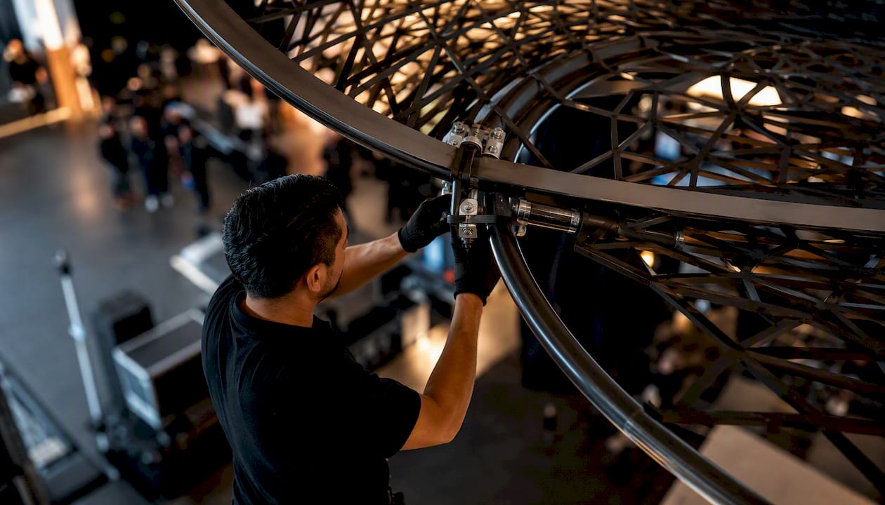 Crew installing custom fabricated event piece