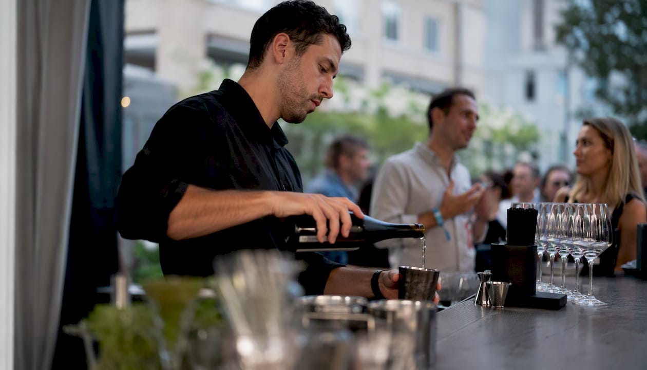 Bartender pouring drinks in controlled event zone