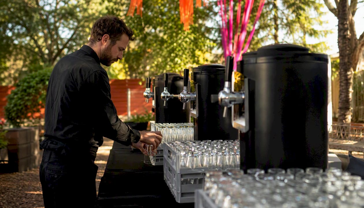 Event staff setting up a temporary bar