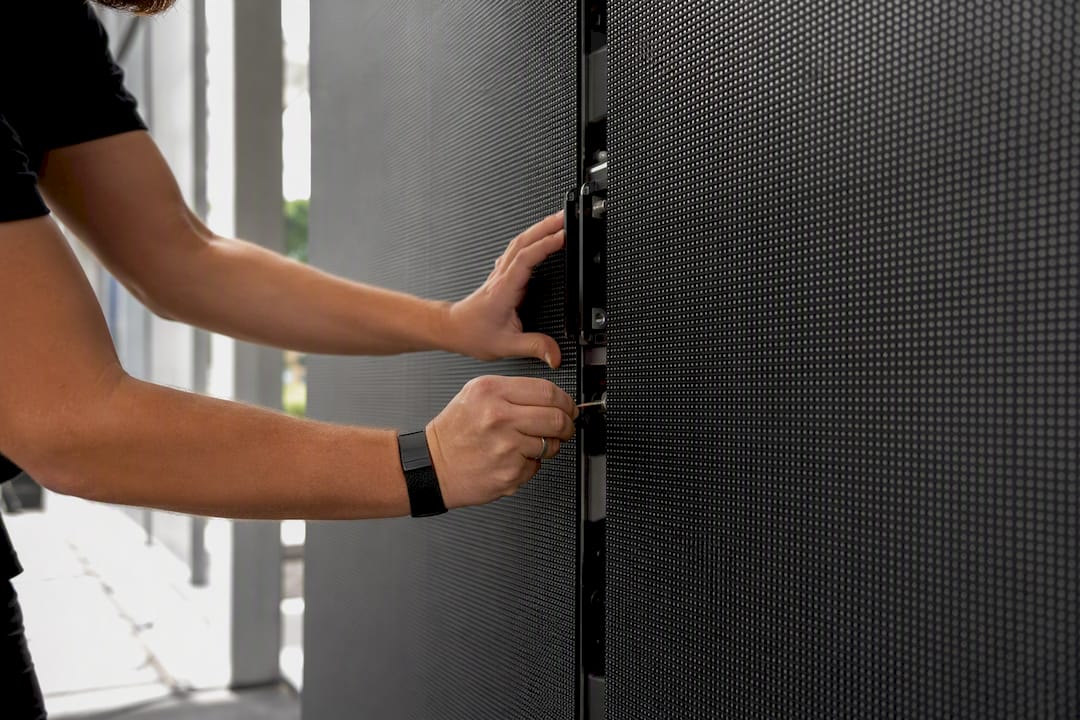 Technician installing LED wall in brand activation