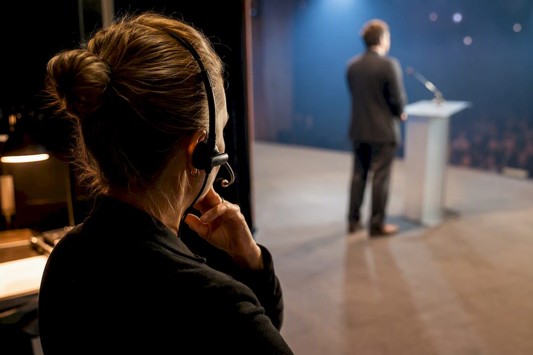 Stage manager monitoring a live event cue