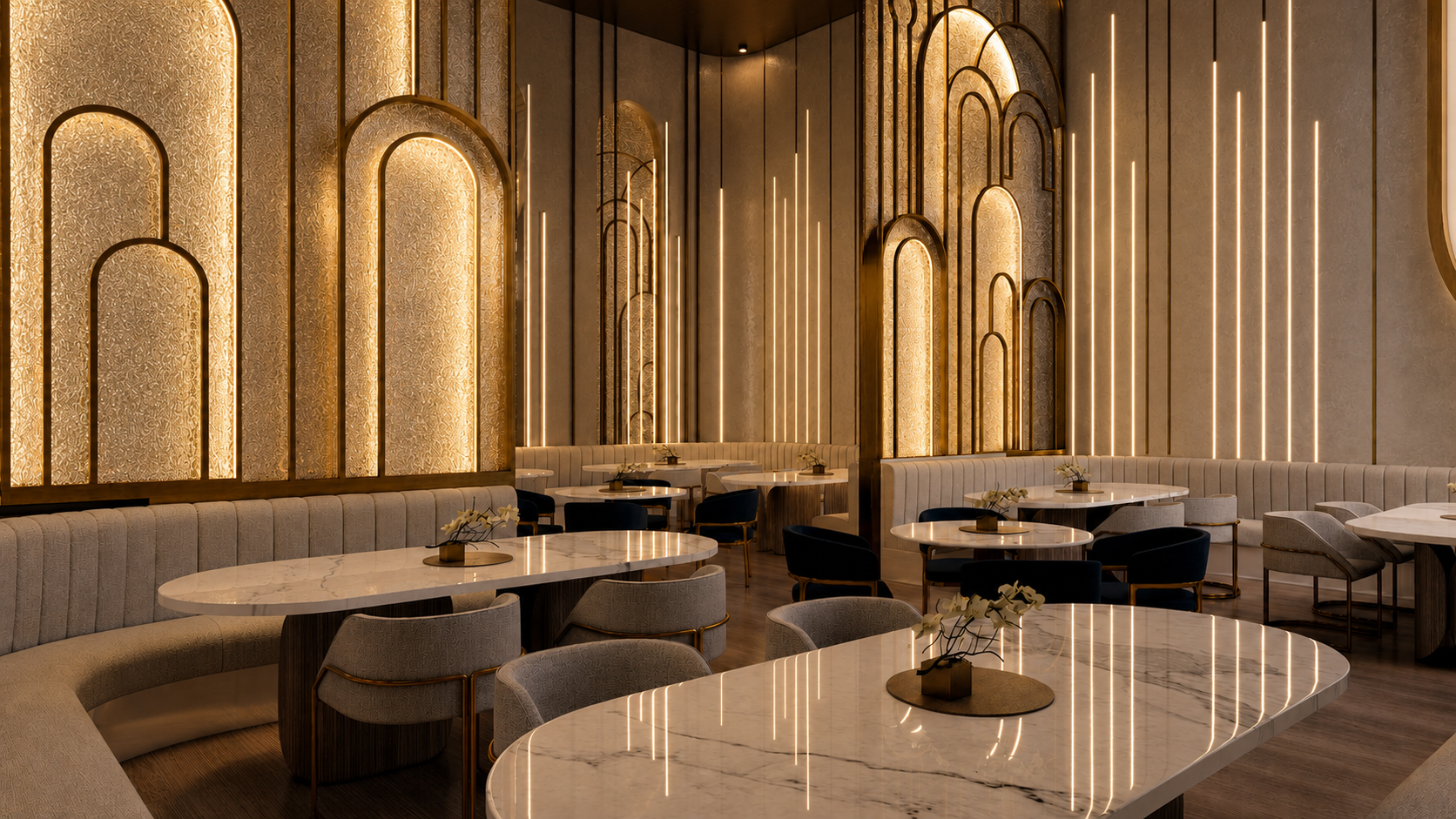 Art deco restaurant interior with illuminated brass arches, cream banquette seating, and marble tables