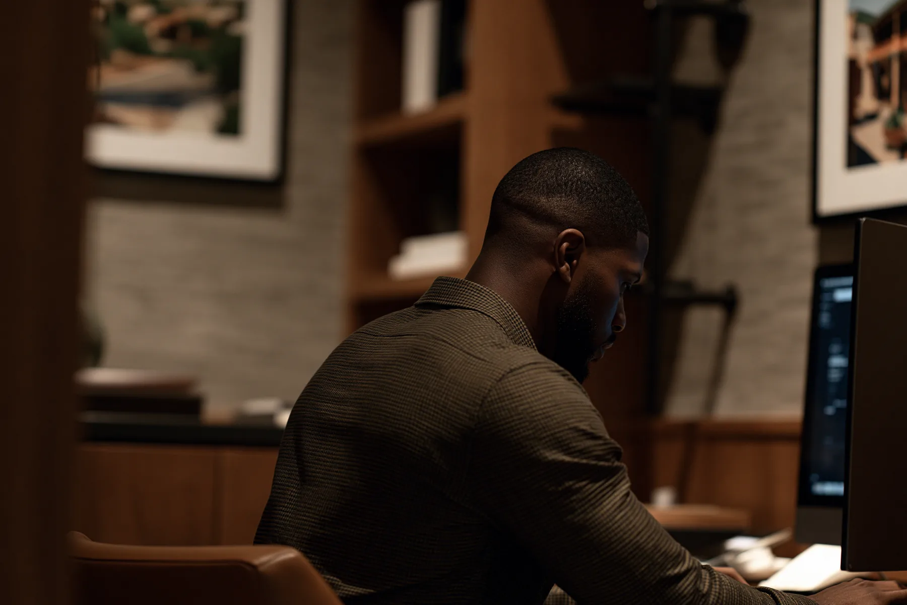 Ethan Cooper, a leasing agent at Mark-Taylor Residential, working at his desk