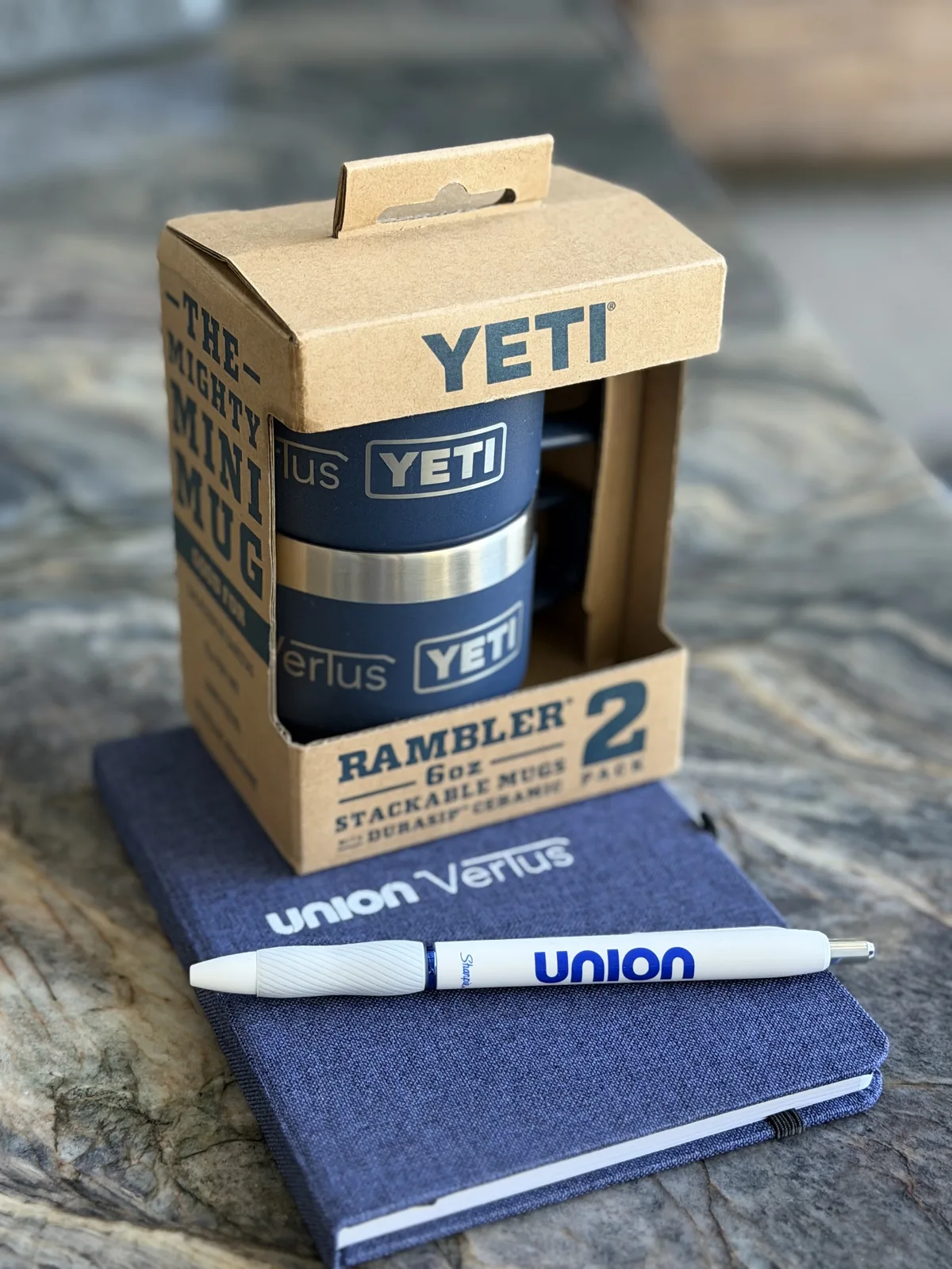 A Union and Vertus co-branded kickoff kit with notebook, pen, and mugs