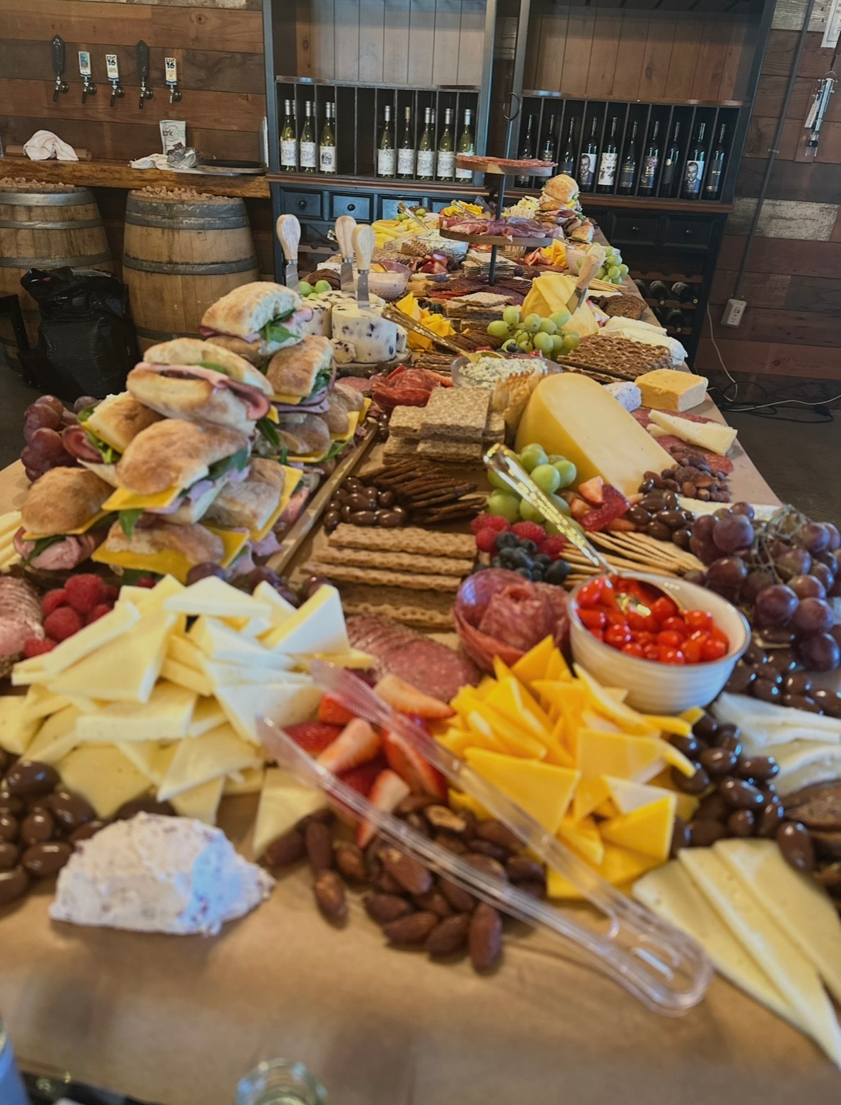 A grazing table of cheese, fruit, and charcuterie