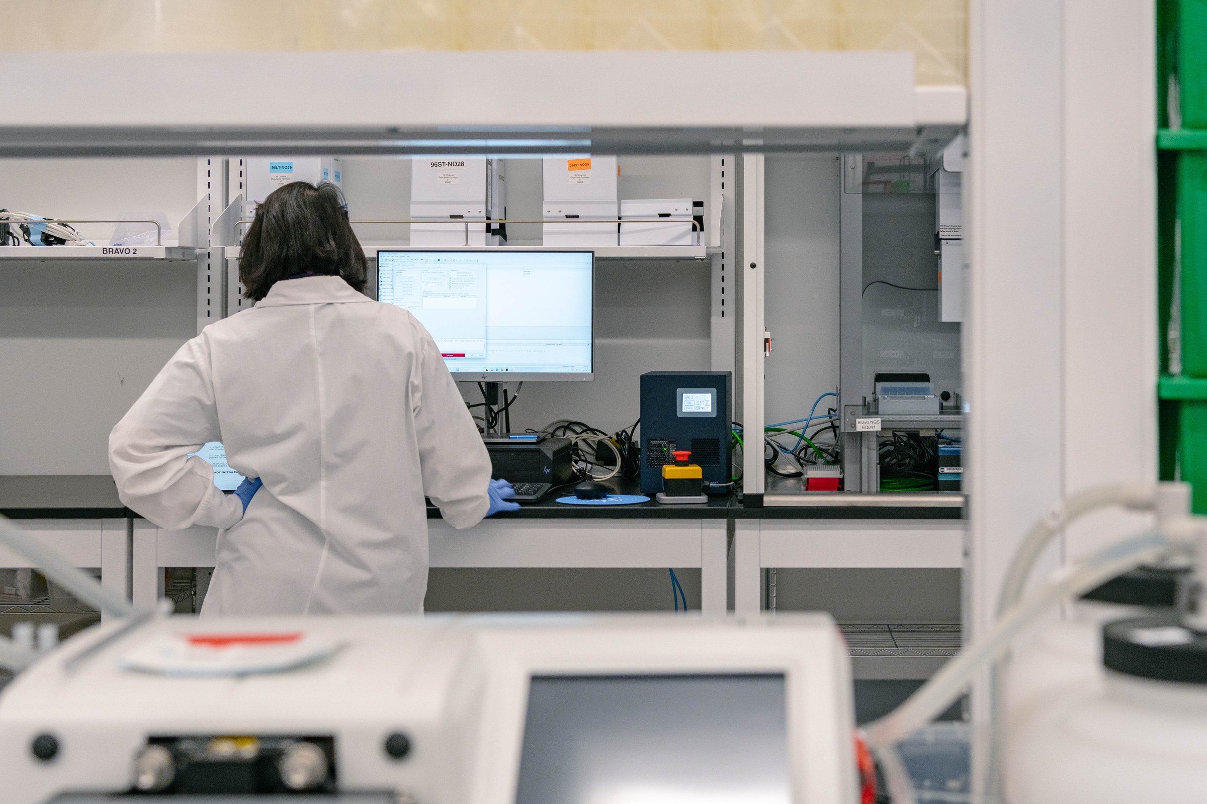 Deep Genomics scientist running experiments at a lab workstation