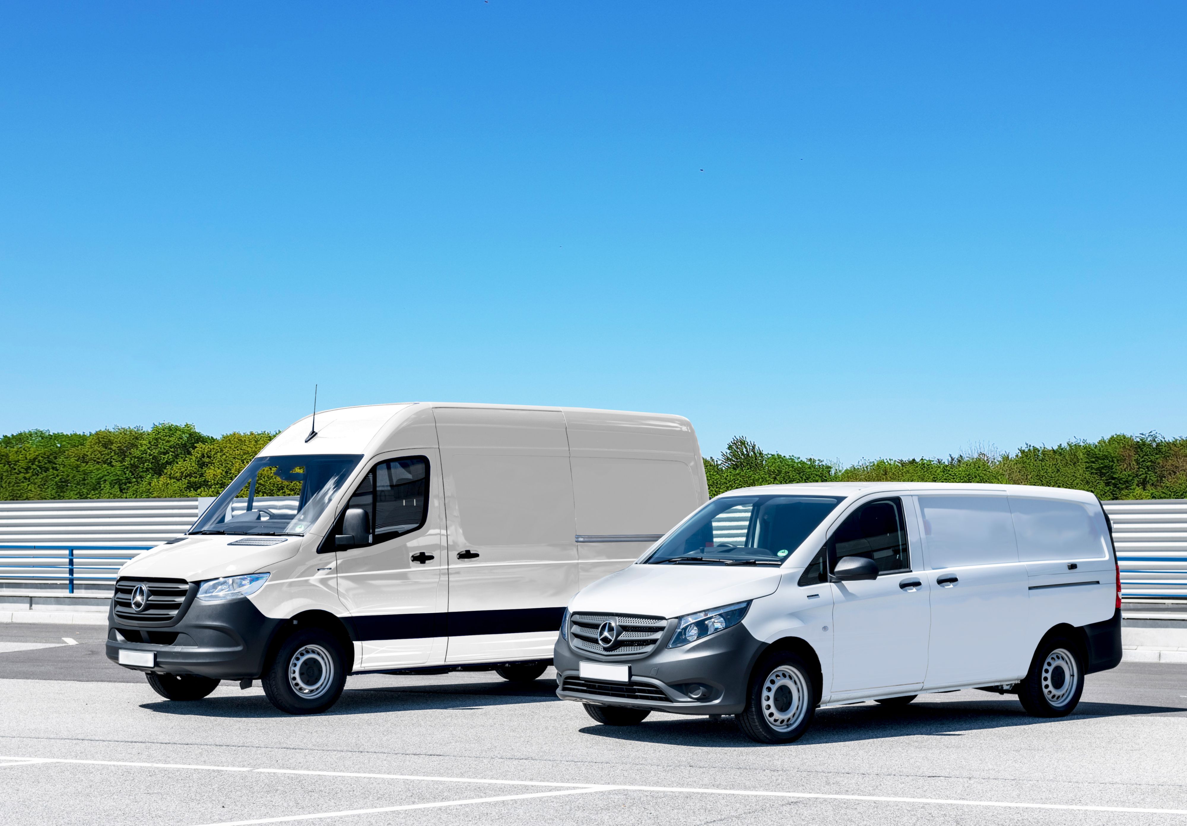 Modern white commercial cargo van parked outside an office building