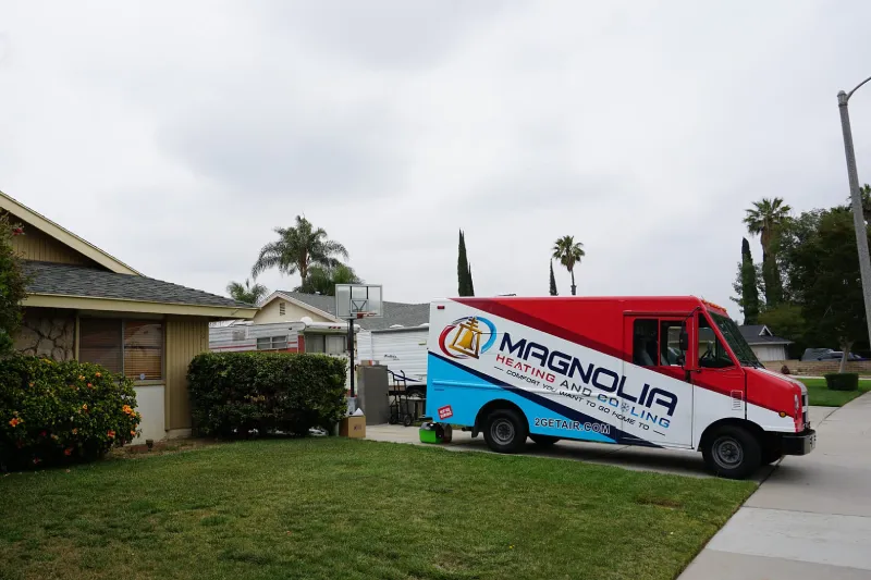 A Magnolia truck sitting outside of a customer's house.