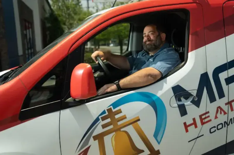 A tech sitting in a truck