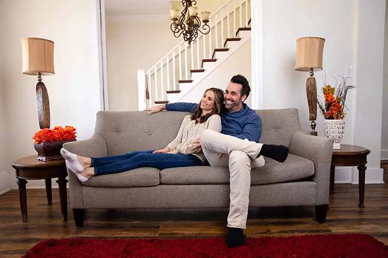 A couple sitting on a couch