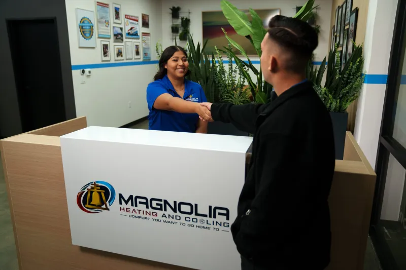 A customer service representative greeting a customer.