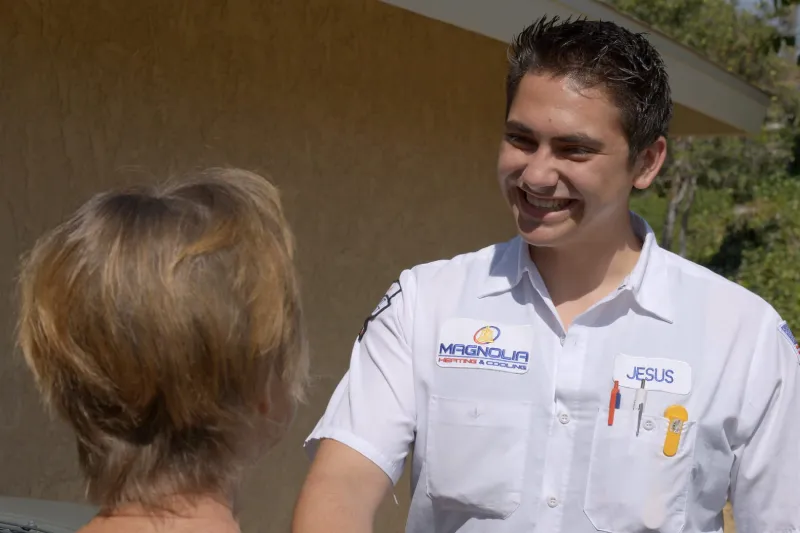 A tech greeting a customer.