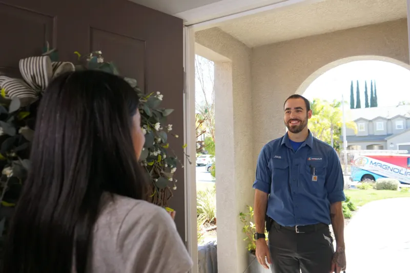 A tech being greeted by a customer.