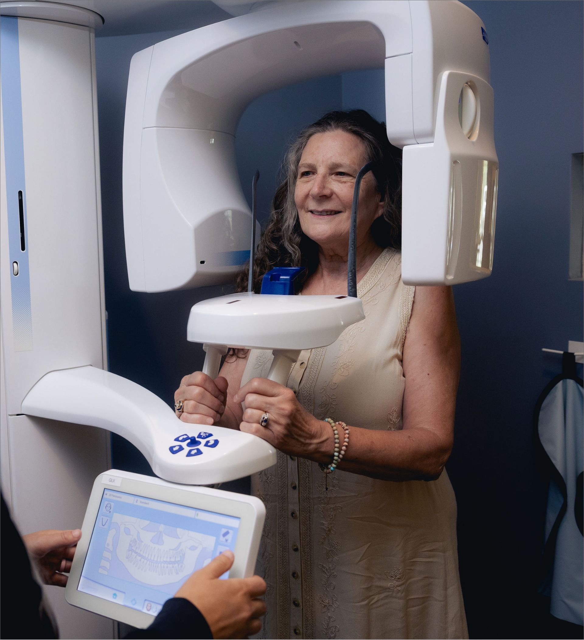 Patient receiving a panoramic X-ray with advanced dental imaging technology