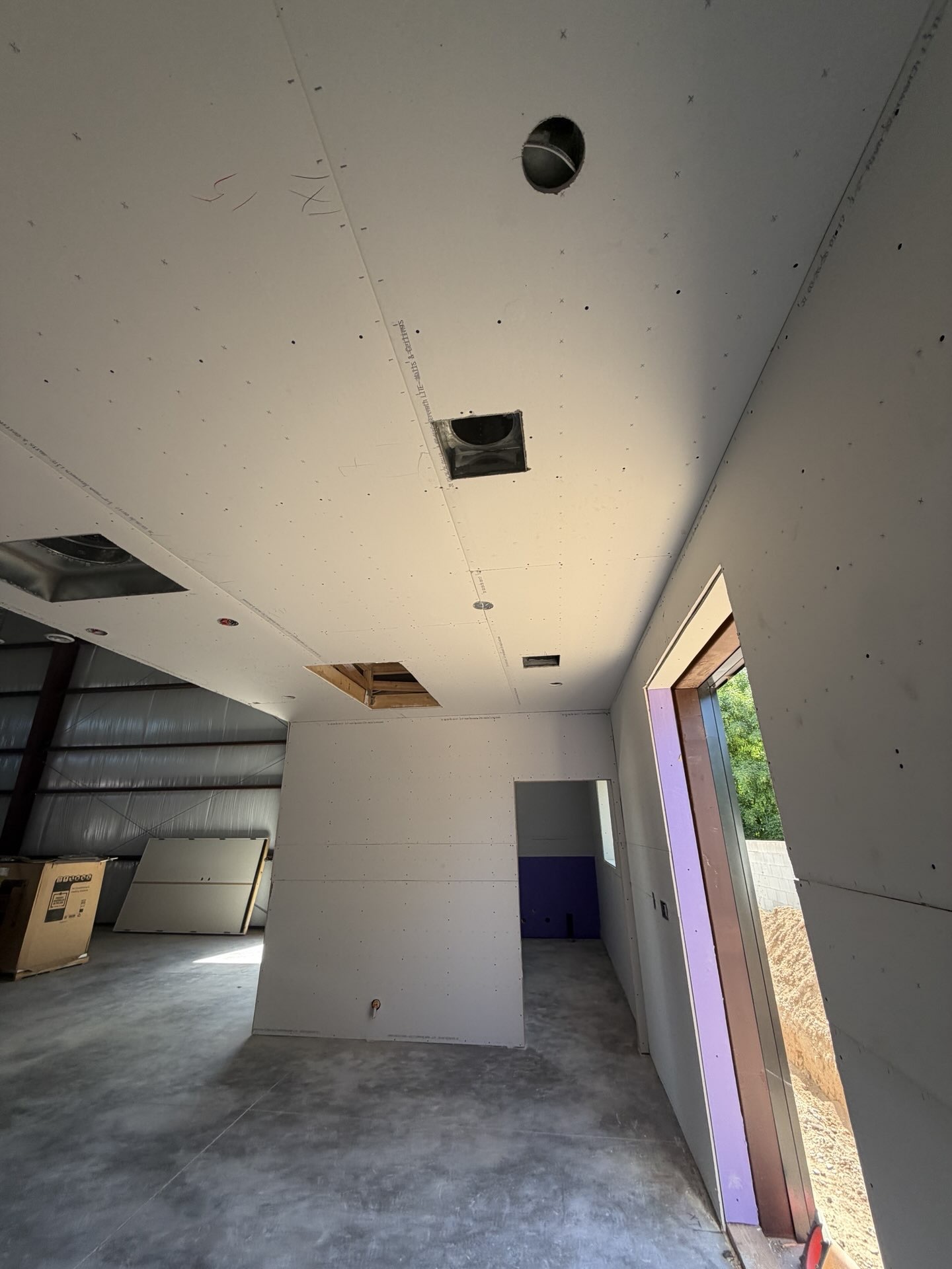 Lawrence and Jessica, owners of LJ Builders, on a job site in the East Valley