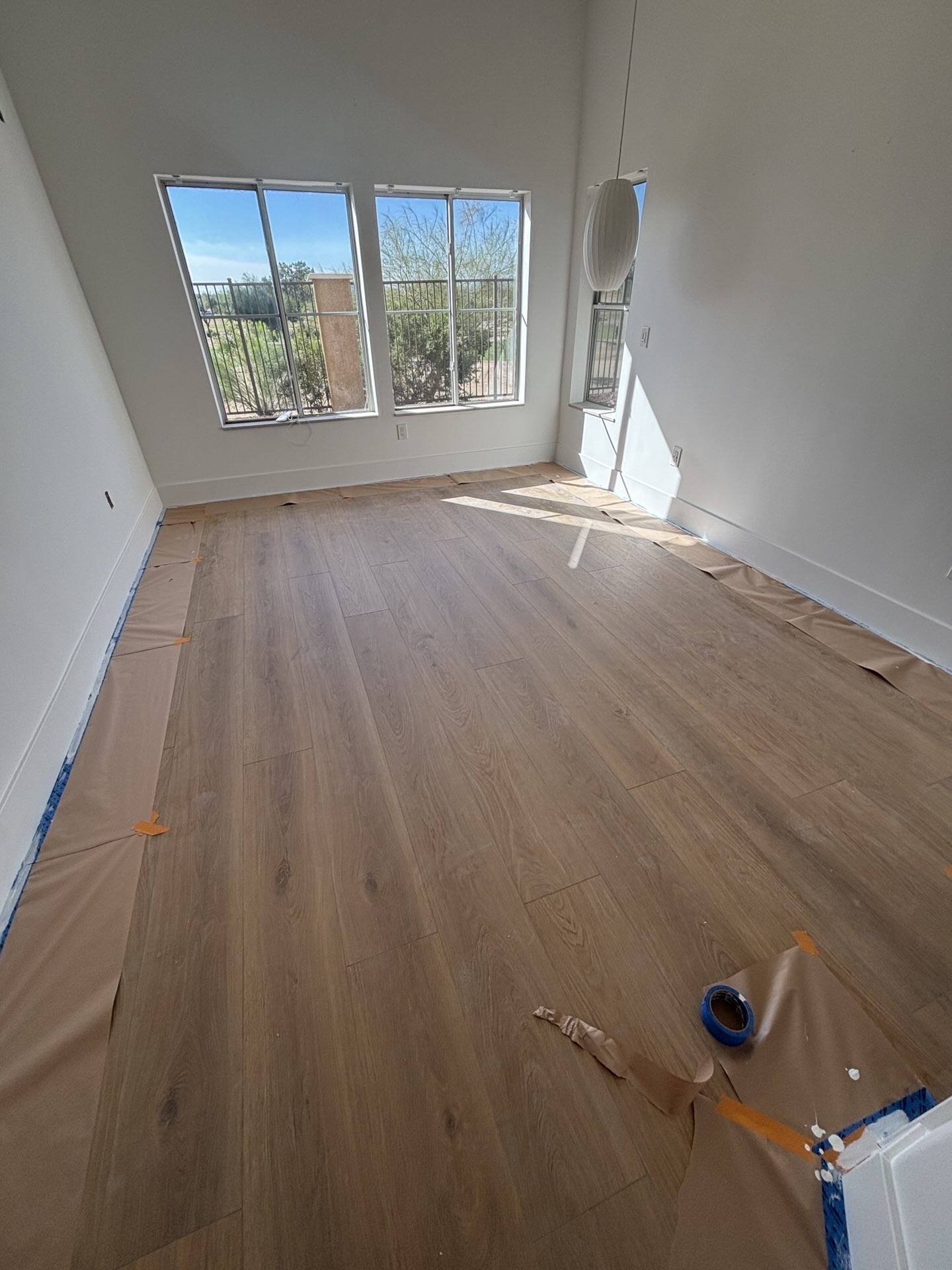 Home with new windows and glass patio doors by LJ Builders