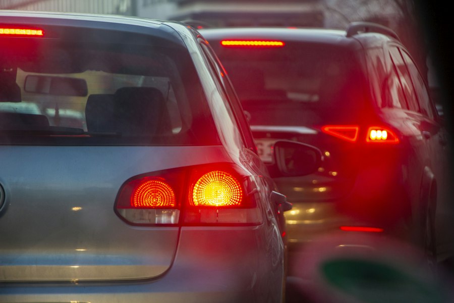 Cars in traffic with brake lights illuminated