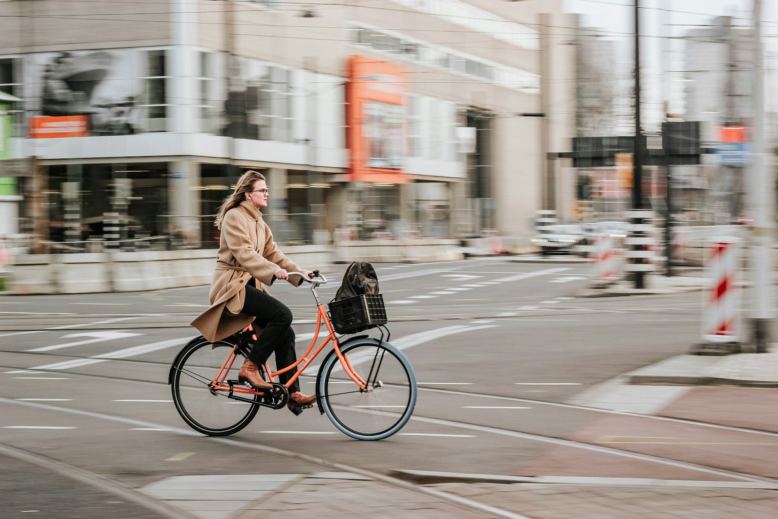 A cyclist crossing an urban street