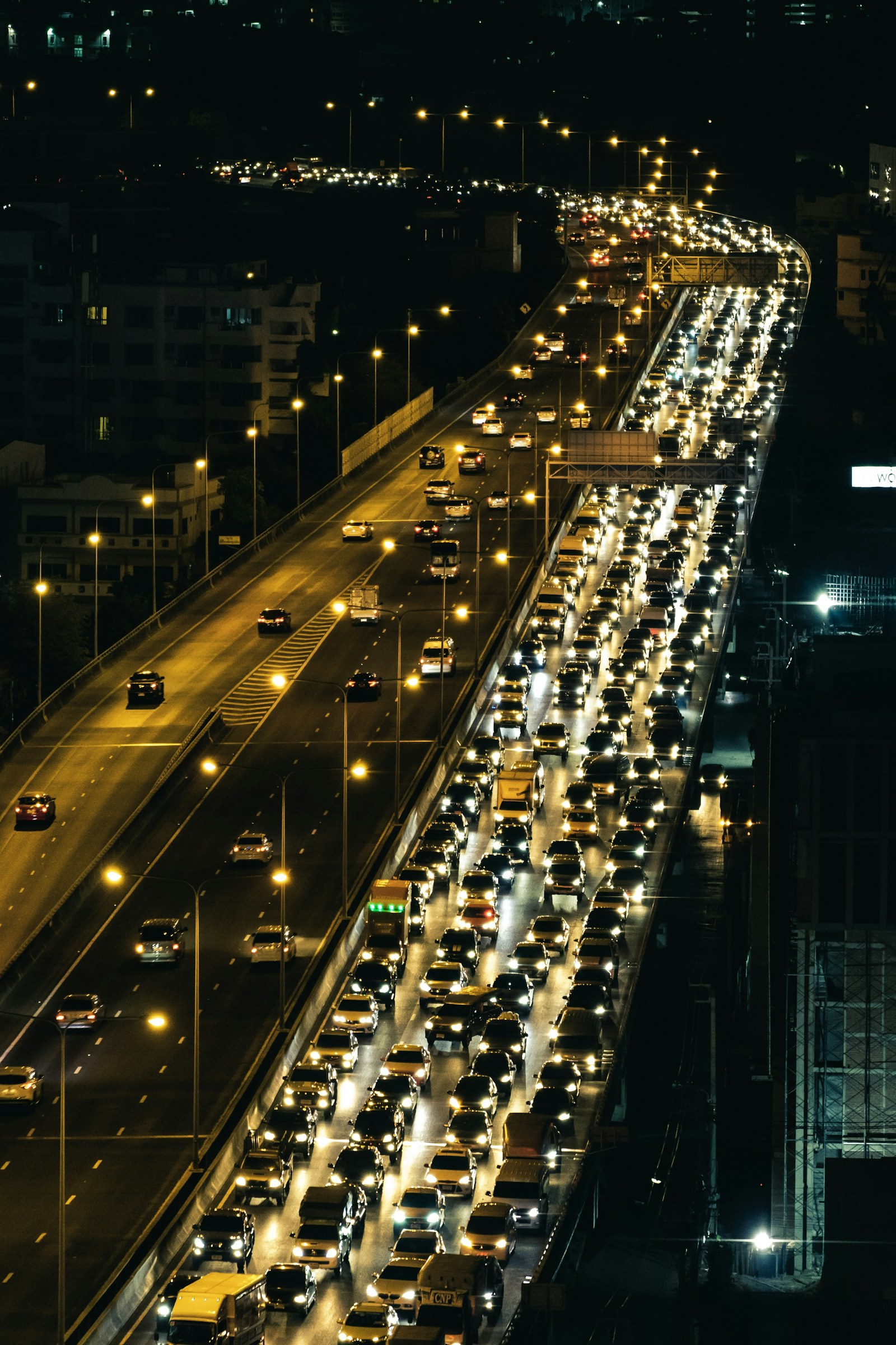 Traffic moving along a highway after dark