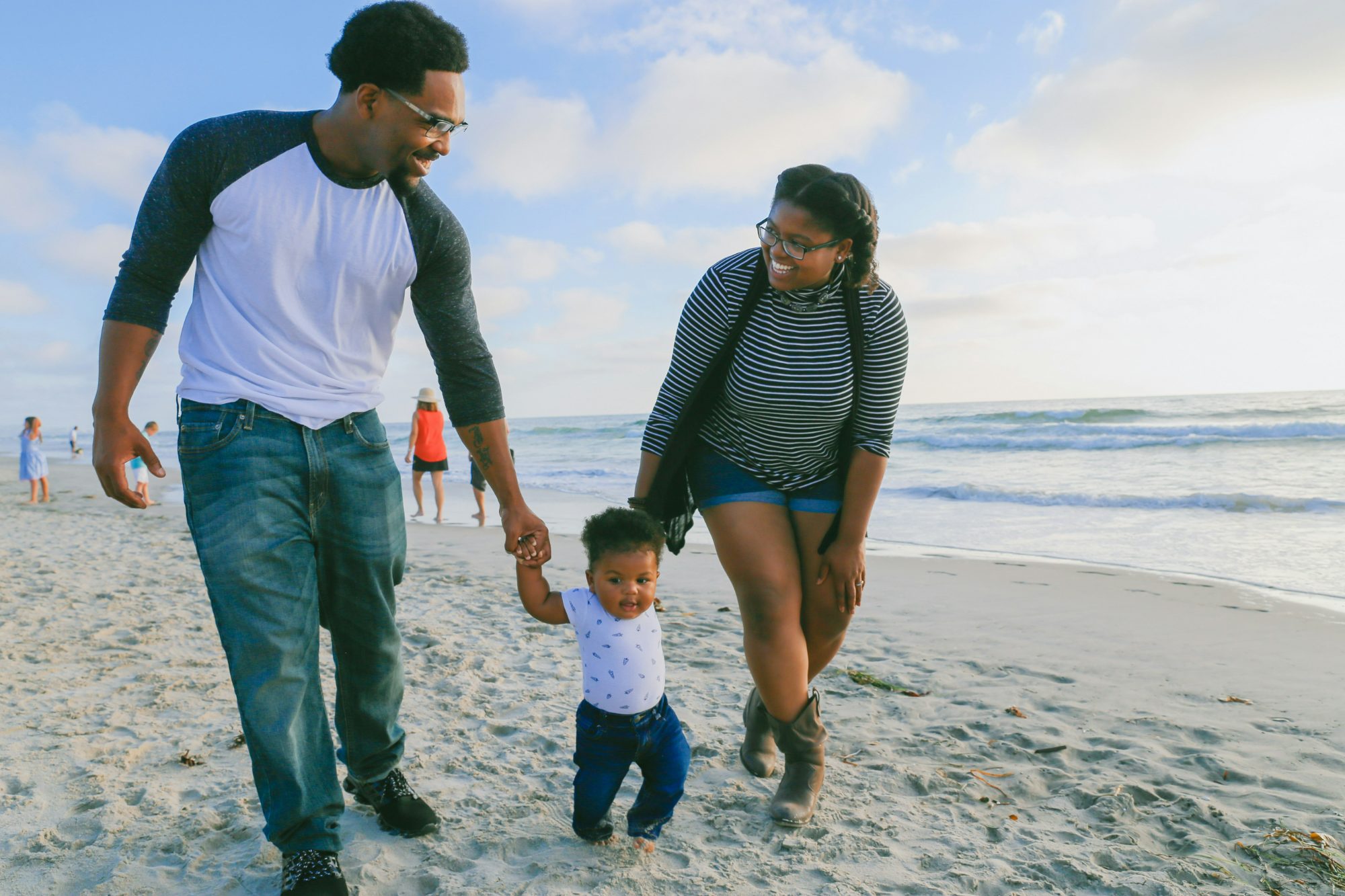 A family walking together on the beach