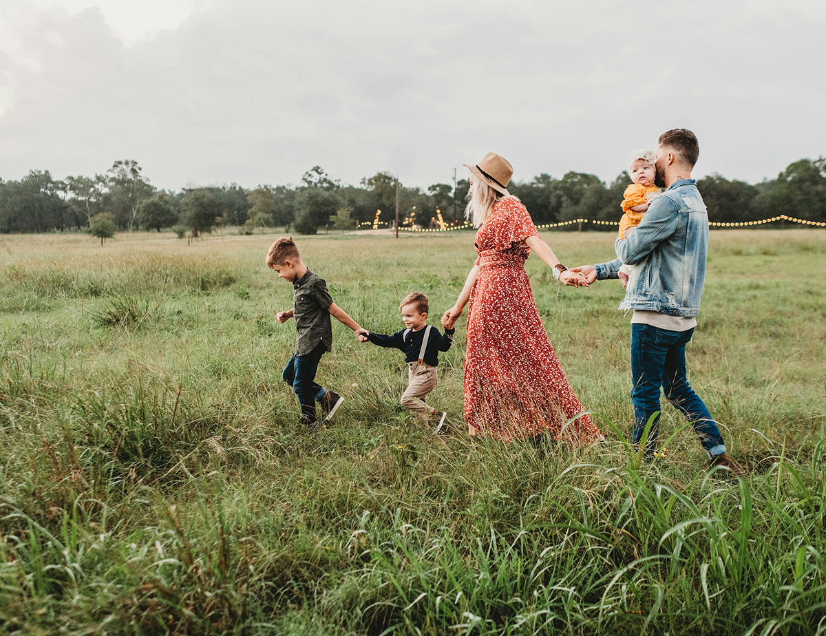 A family walking together in a Georgia field