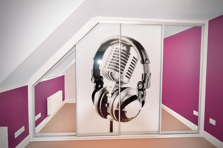 Room with angled ceiling and magenta walls, featuring sliding closet doors with a large printed image of a vintage microphone wearing black headphones.