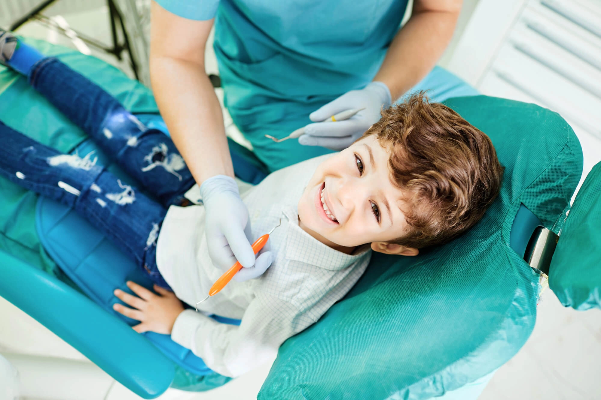 little boy smiling at the dentist
