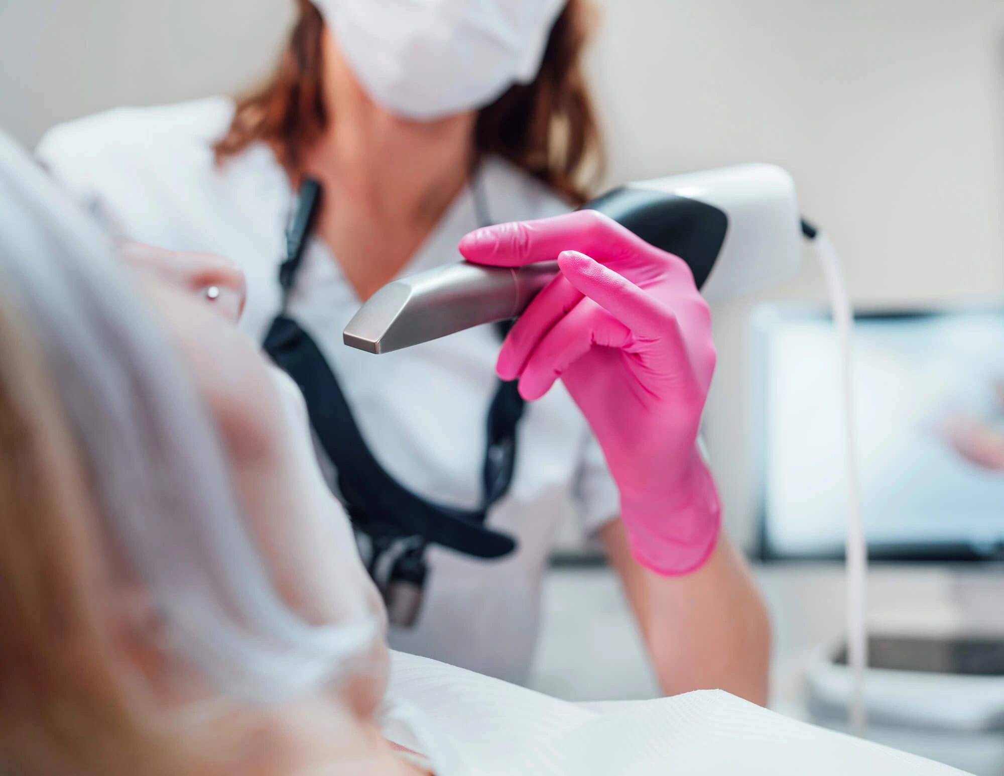 woman getting a dental scan with an intraoral camera