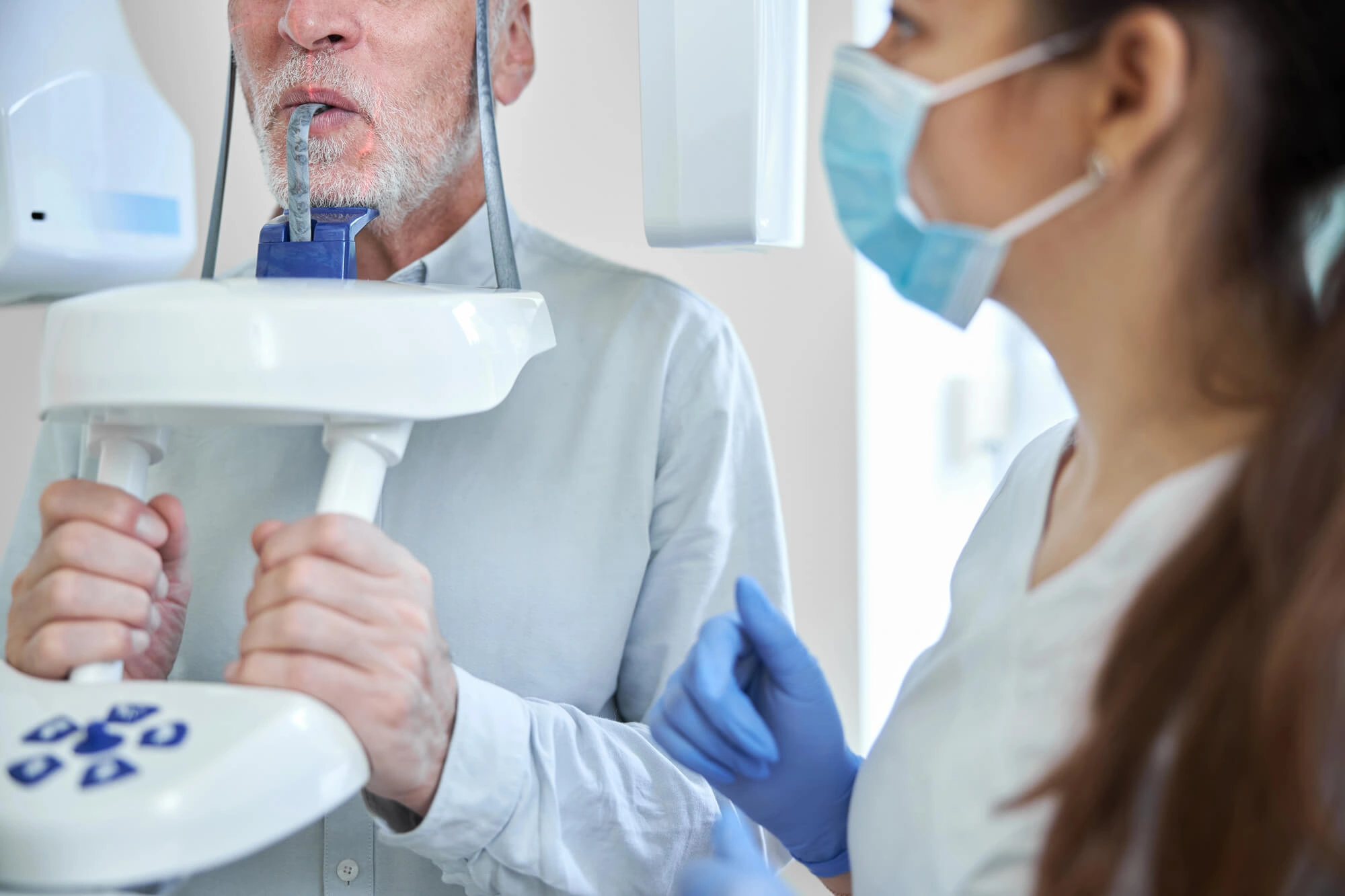 man getting a CBCT scan at the dentist