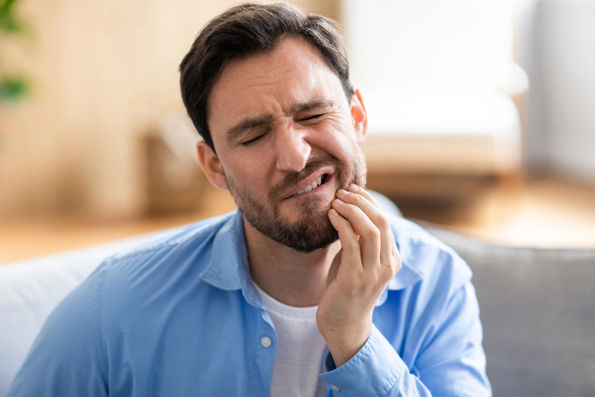 man with dental pain