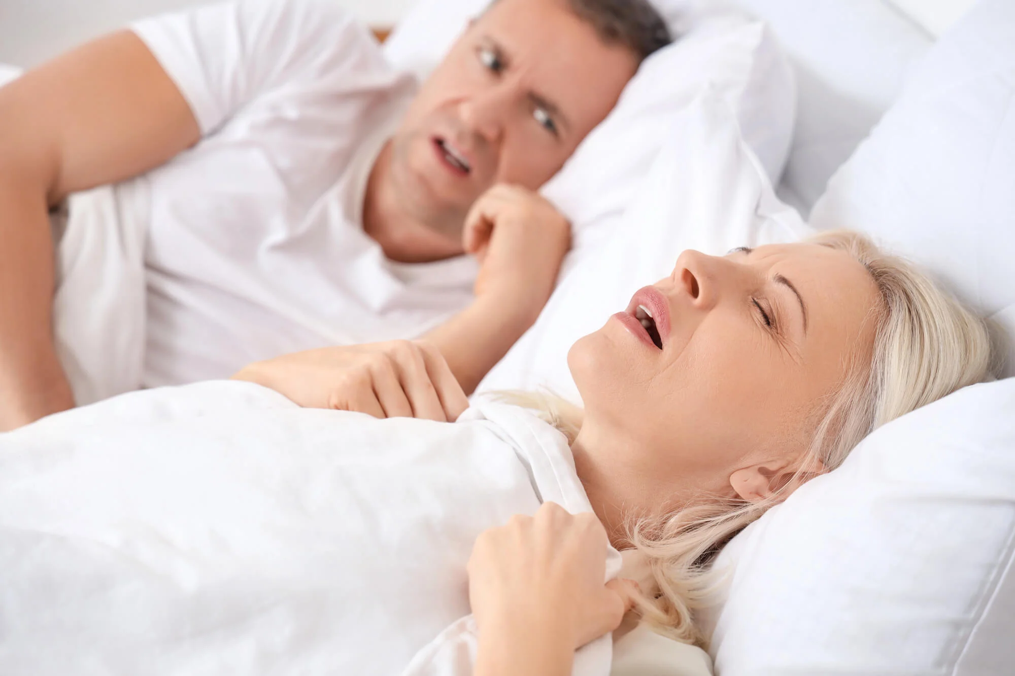 woman snoring and husband bothered