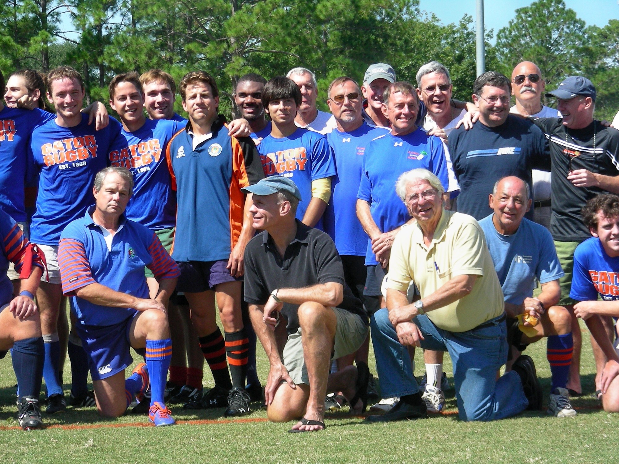 Gator rugby alumni and current players together on the pitch at an Alumni Weekend