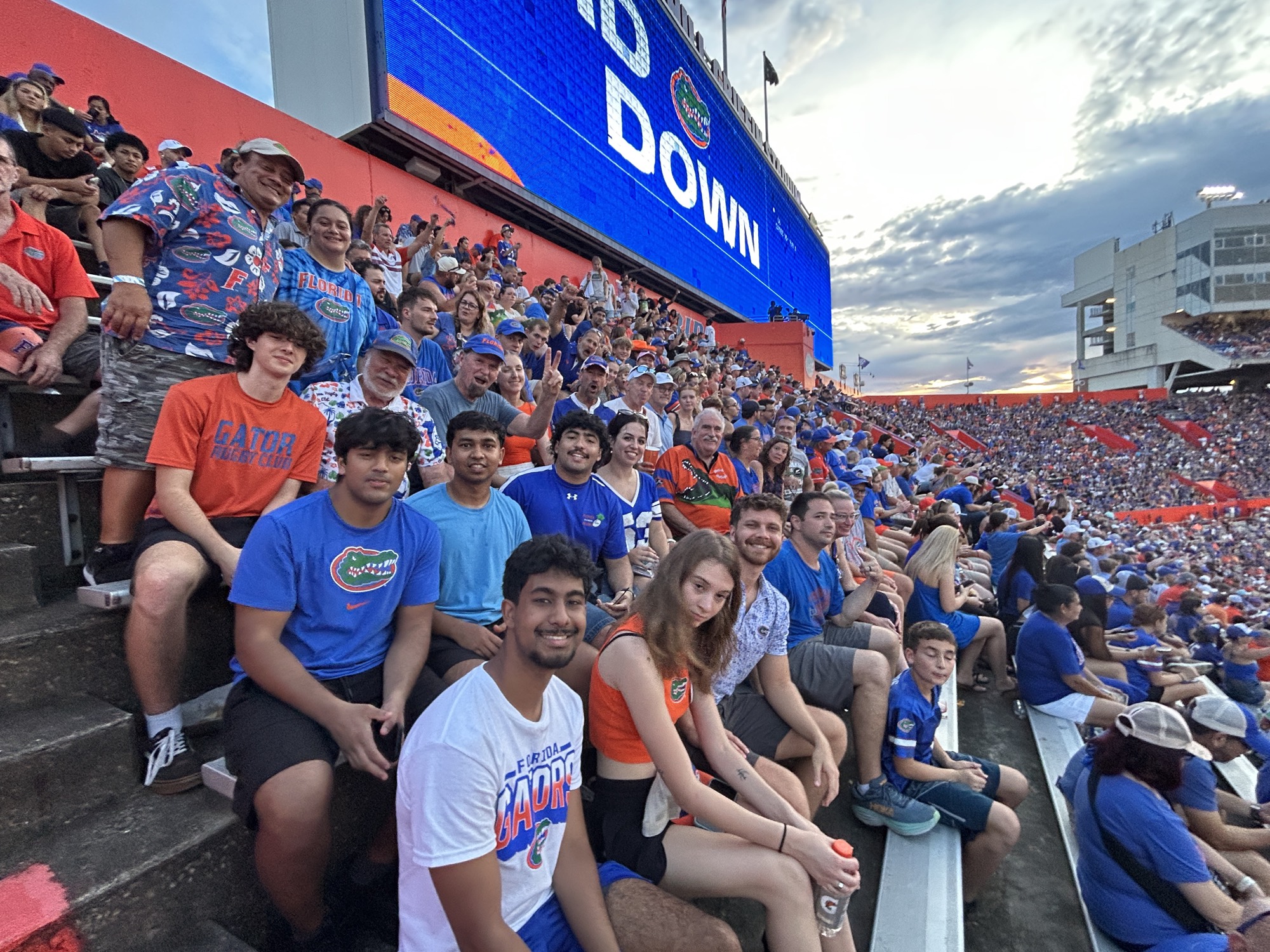 A large group of Gators rugby players filling a row in the stands at Ben Hill Griffin Stadium