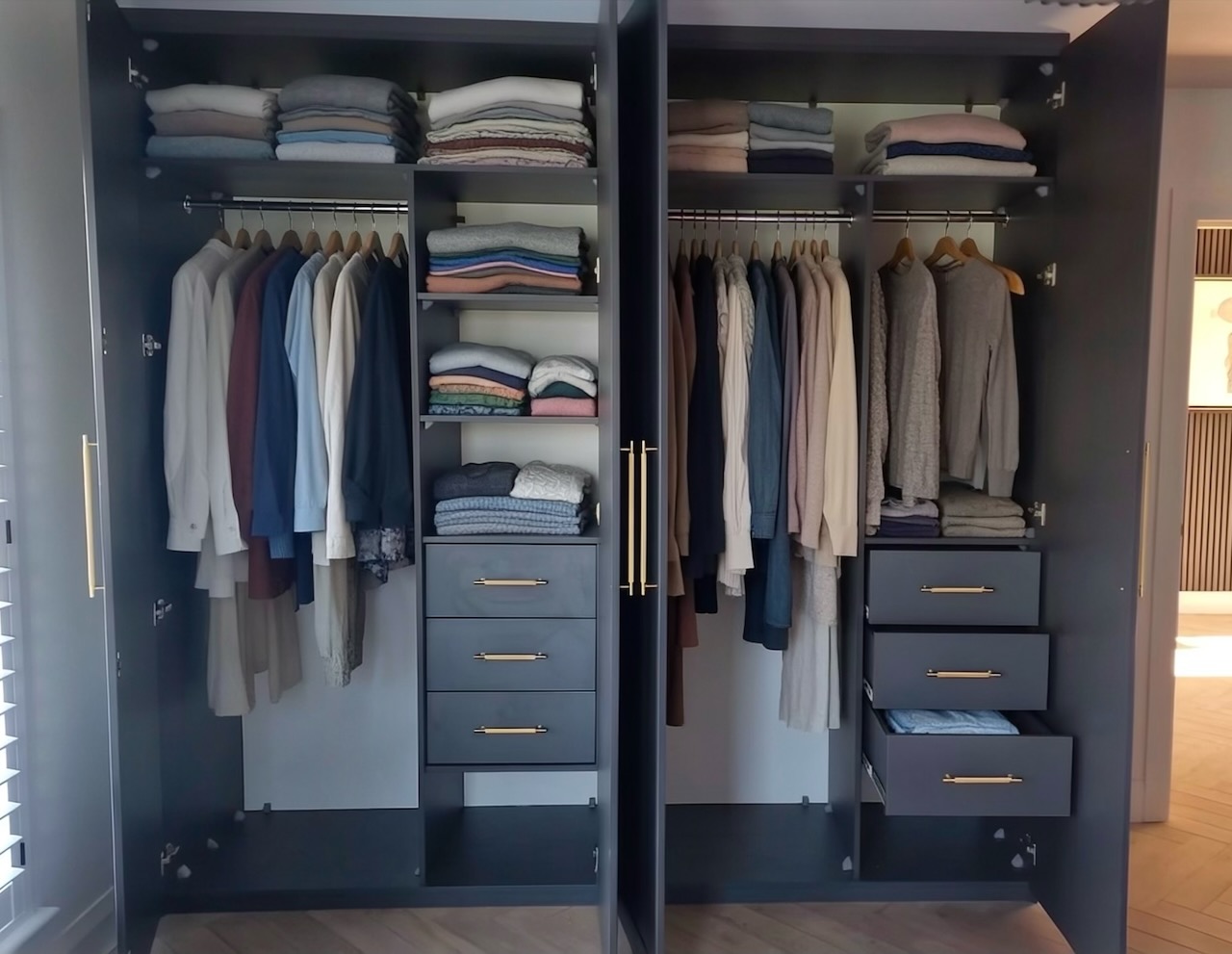 Organised made-to-measure fitted wardrobe interior with double hanging rails, drawers, shelves, shoe storage and high-level storage in a bright bedroom