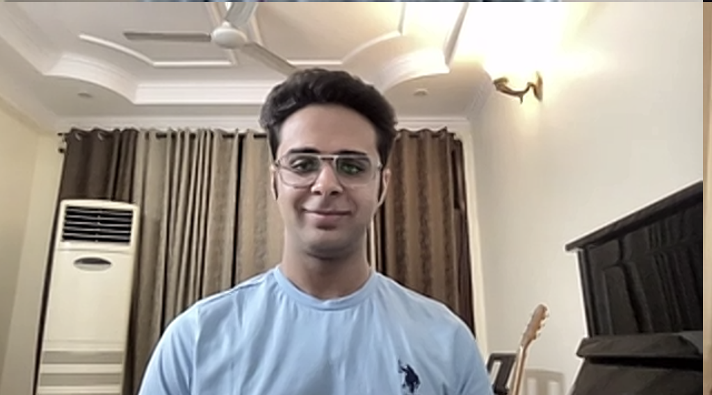Kartik at his piano during an online lesson