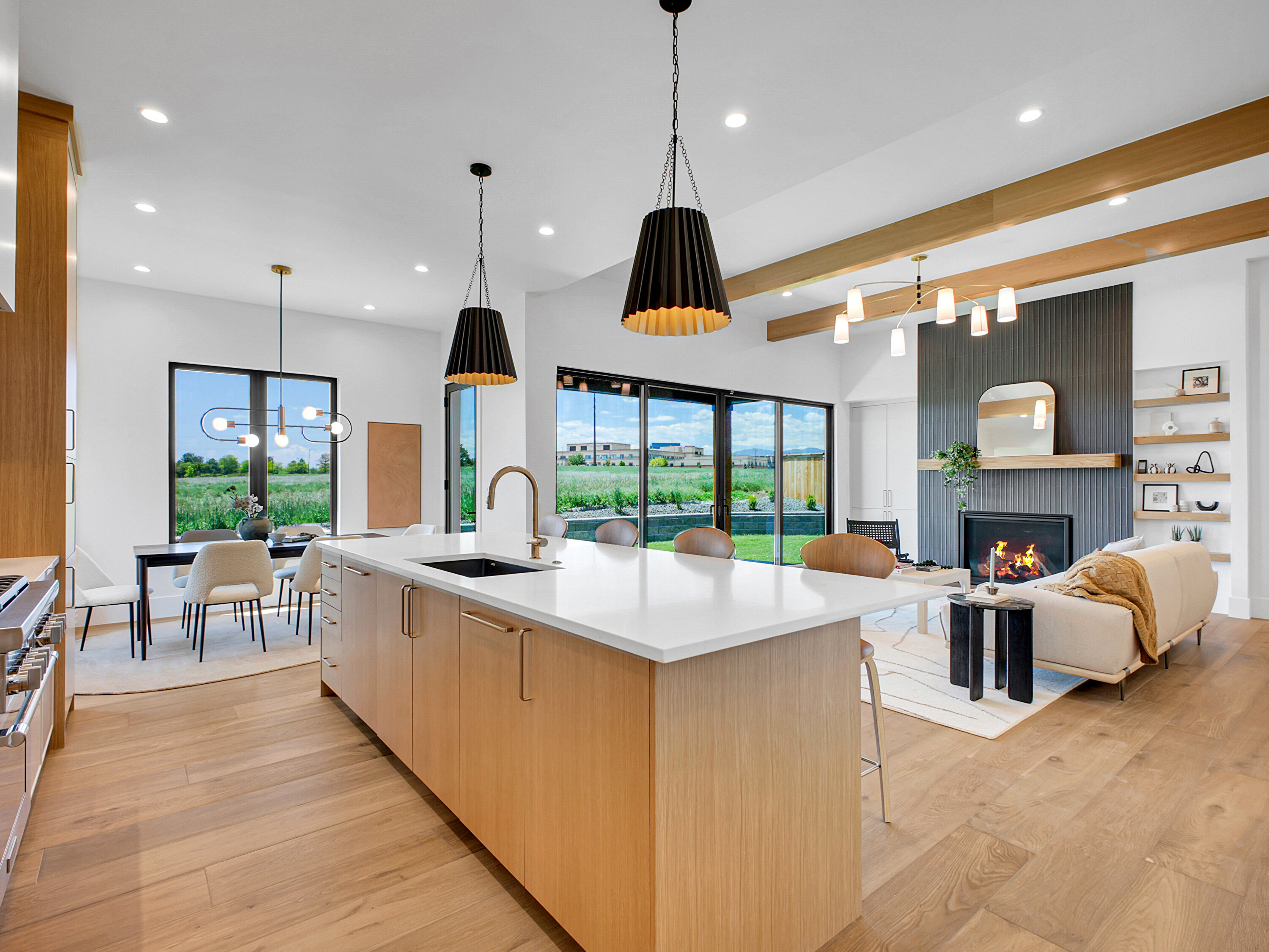 Open kitchen and great room with fireplace designed for shared family living