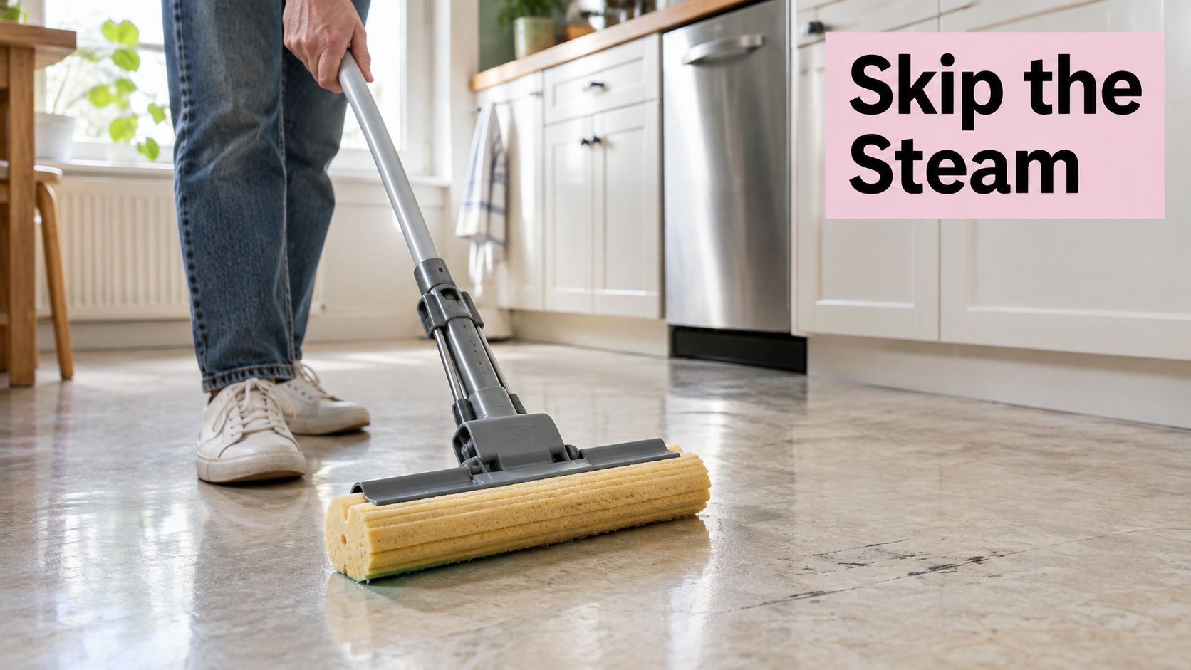 A person cleaning linoleum flooring with a sponge mop in a bright, modern kitchen setting.